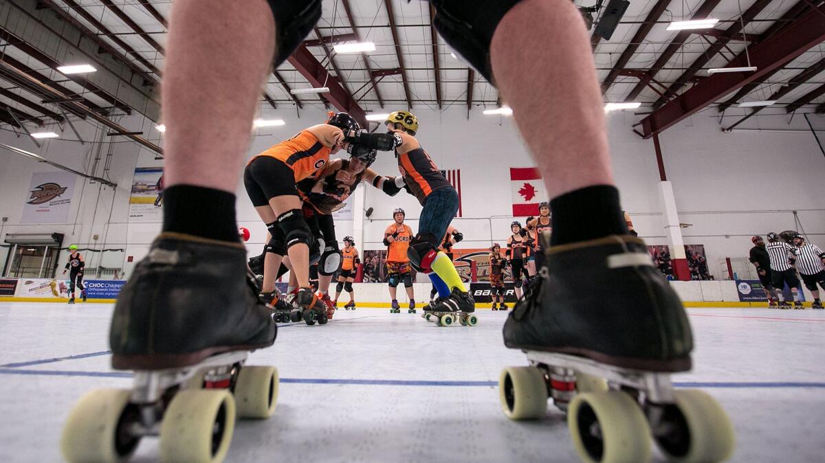 Members of the Orange County Roller Derby league practice at The Rinks in Huntington Beach. Derby is competitive, and a full-contact sport.
