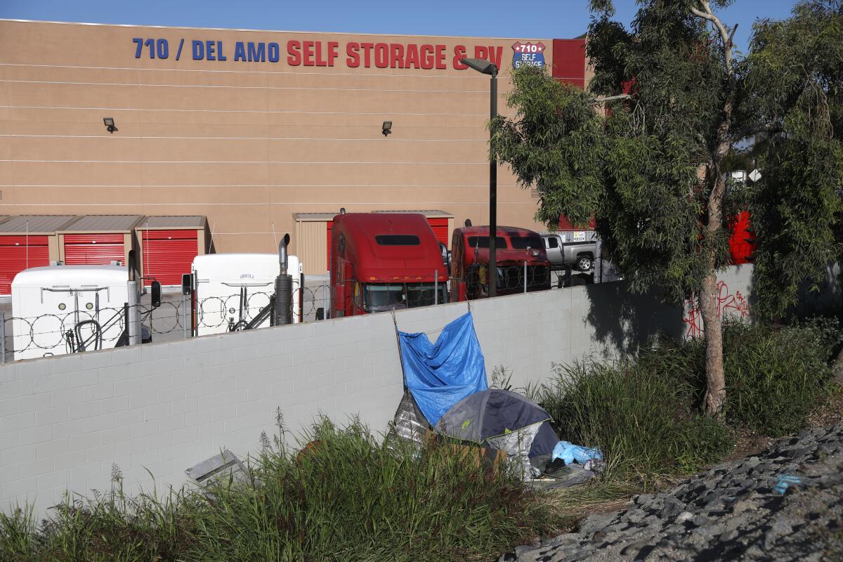 A building with the words "Del Amo Self Storage and RV."