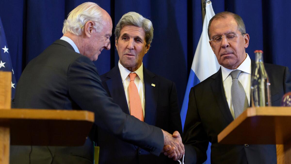 Staffan de Mistura, the U.N. Special Envoy for the crisis in Syria, shakes hands with Russian Foreign Minister Sergei Lavrov while U.S. Secretary of State John Kerry looks on during a press conference in Geneva, Switzerland on Sept. 9.