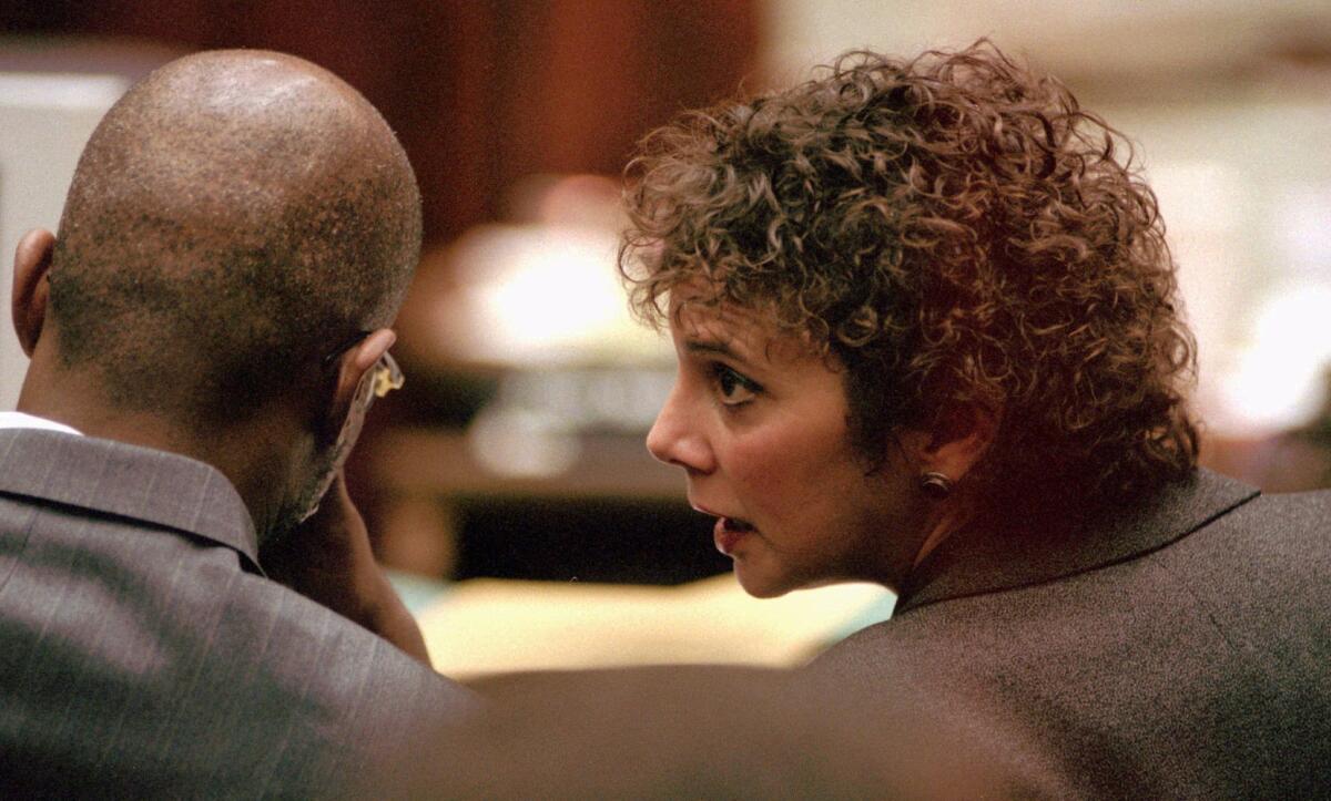 (l-r) Christopher Darden and Marcia Clark consult during the O.J. Simpson trial.