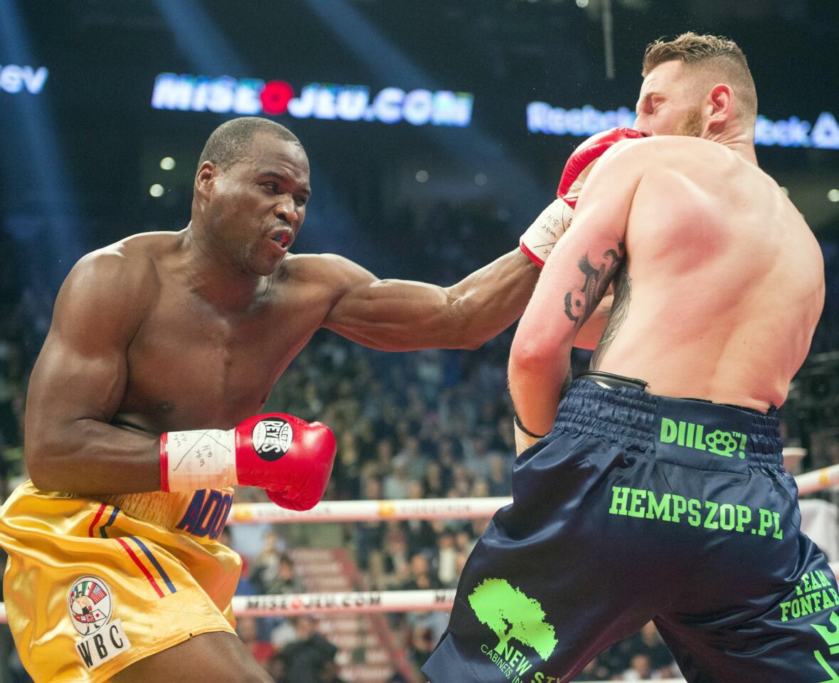 Adonis Stevenson, left, from Canada, lands a left to the head of Andrzej Fonfara, from Poland, during a WBC light-heavyweight championship fight Saturday, June 3, 2017, in Montreal. (Ryan Remiorz/The Canadian Press via AP)