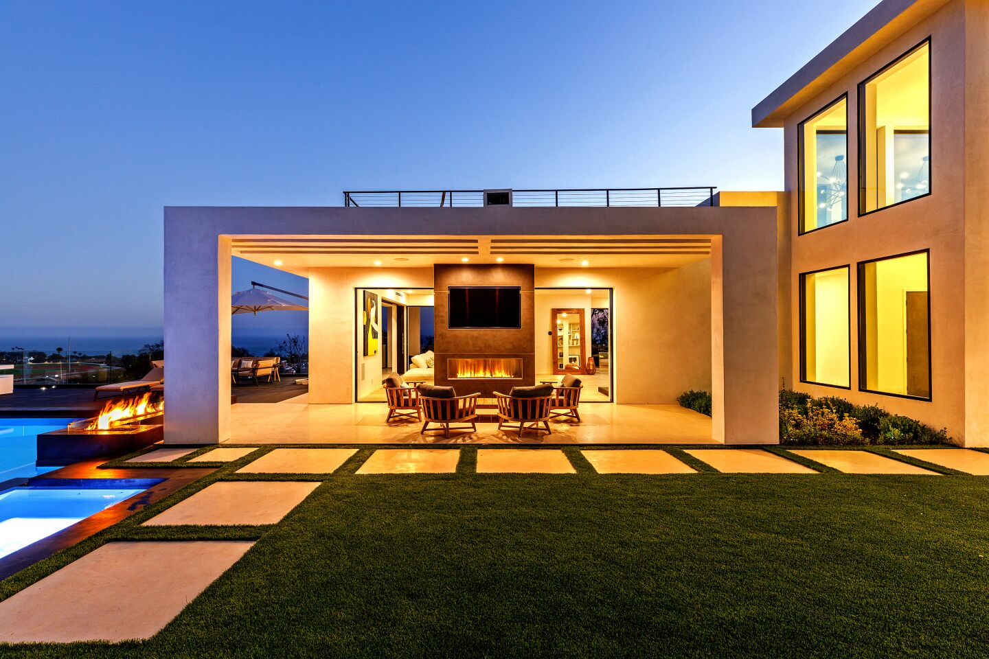 The newly-finished home near Zuma Beach is geared for indoor-outdoor living with pocketing walls, wrap-around terraces, balconies and a rooftop deck.