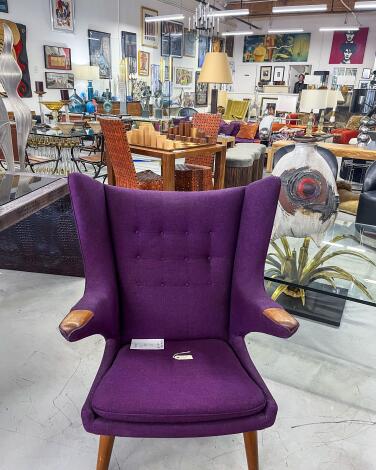 A purple chair in a store.