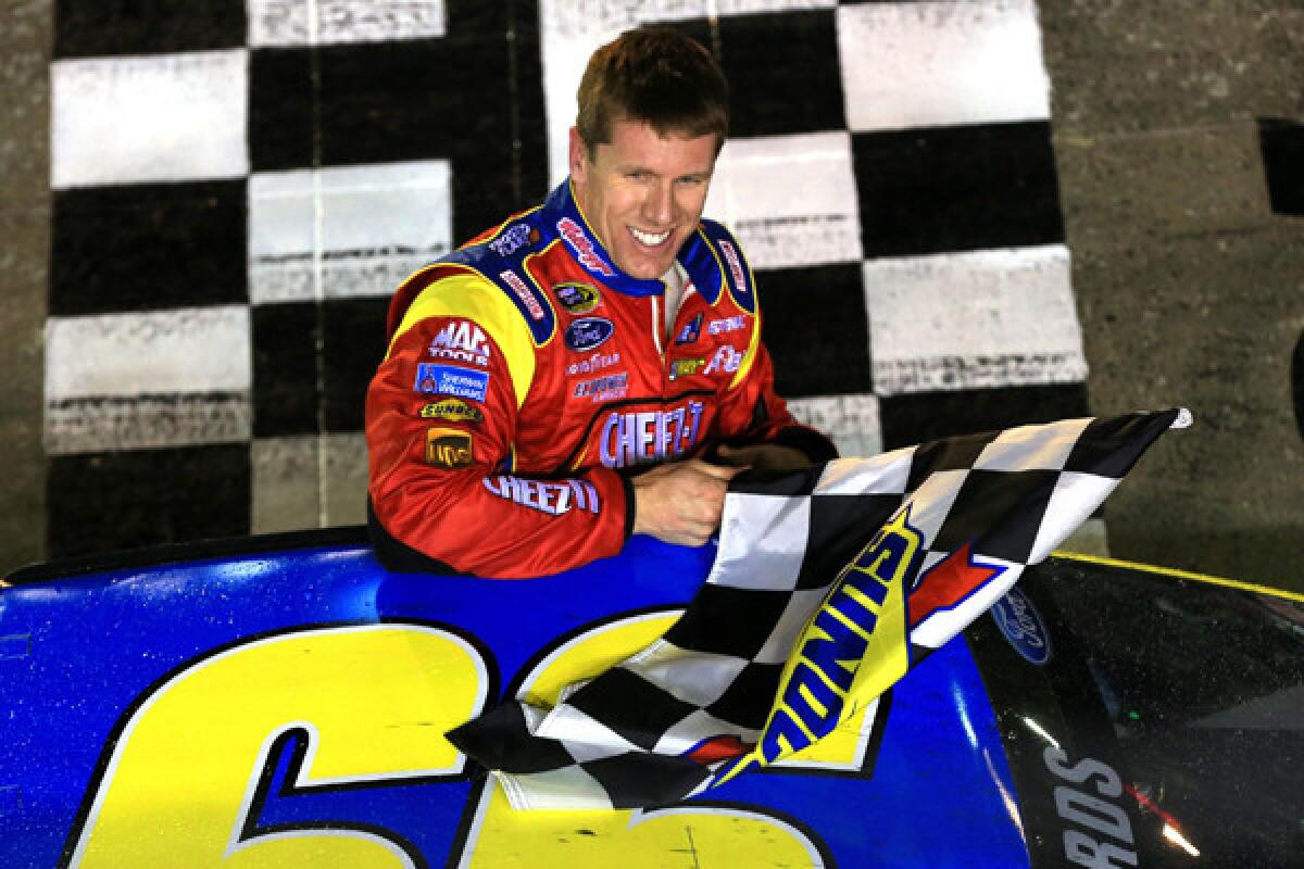 NASCAR driver Carl Edwards celebrates after winning the Food City 500 on Sunday at Bristol Motor Speedway.