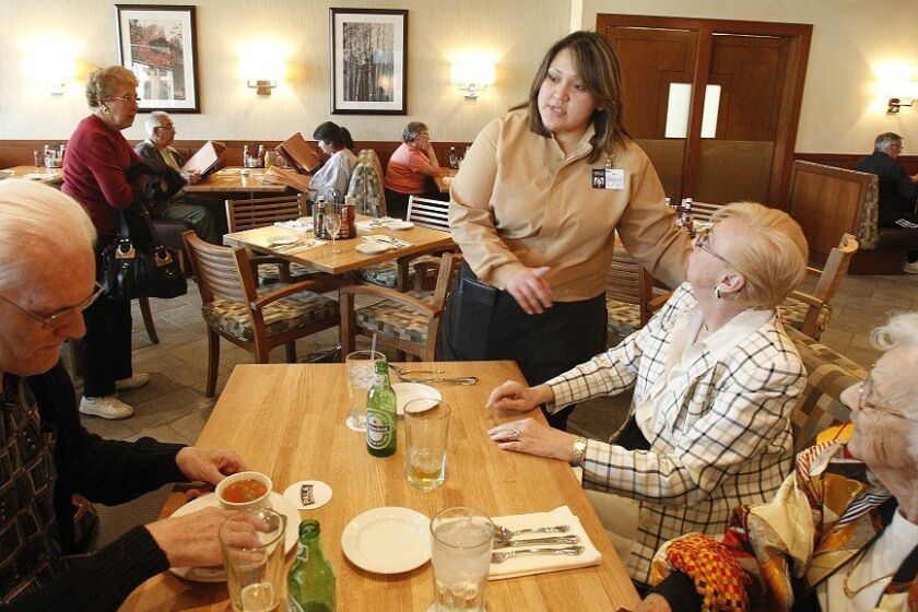 Joria “Riri” Mesa (center, right) can take any size order without aid of pencil or pen at the Pala Cafe in the Pala Resort and Casino. Here, she waited on Dick Kurczynski (left), his wife, Judy (top right), and his mother-in-law Evelyn Dunn (bottom right).