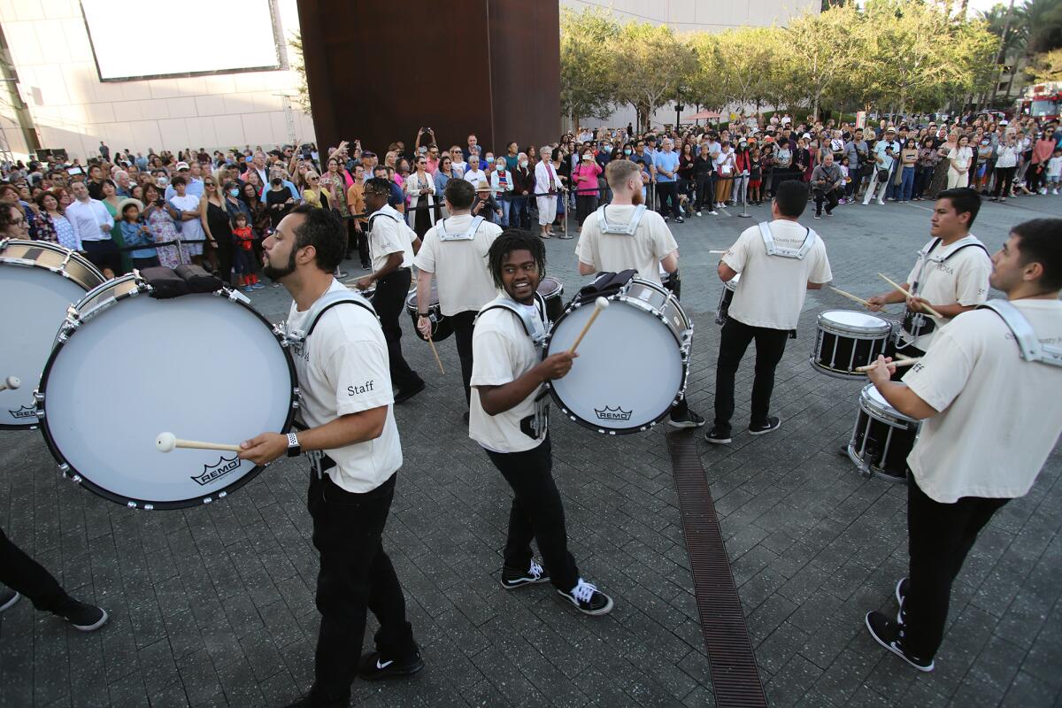A drumline from performs during an opening night ceremony at the Orange County Museum of Art in Costa Mesa.