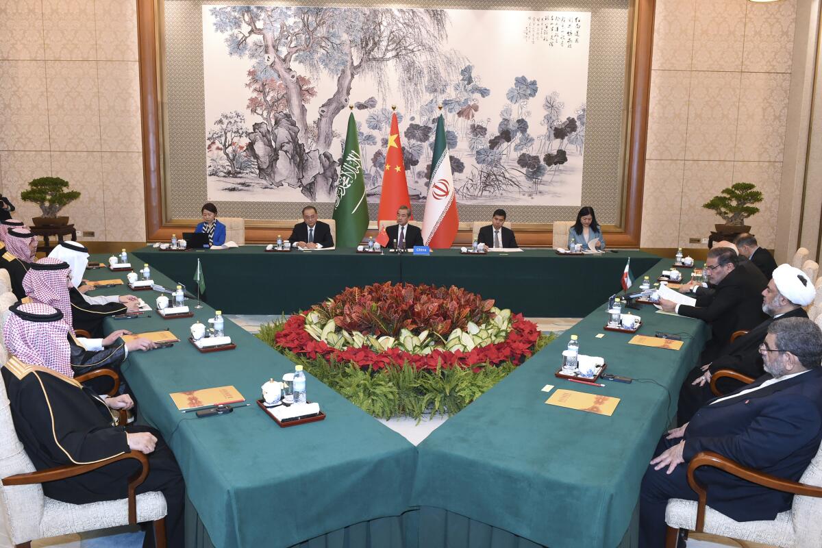 Saudi, Iranian and Chinese diplomats in a meeting