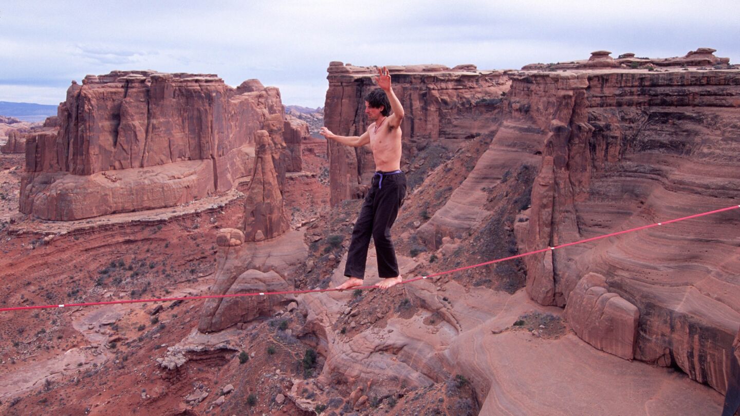 Dean Potter "highlining" at the Three Gossips in Arches National Park in Utah in 2004.