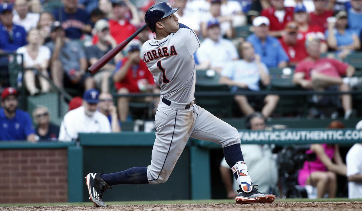 Houston Astros' Carlos Correa bats against the Texas Rangers during a game Saturday.