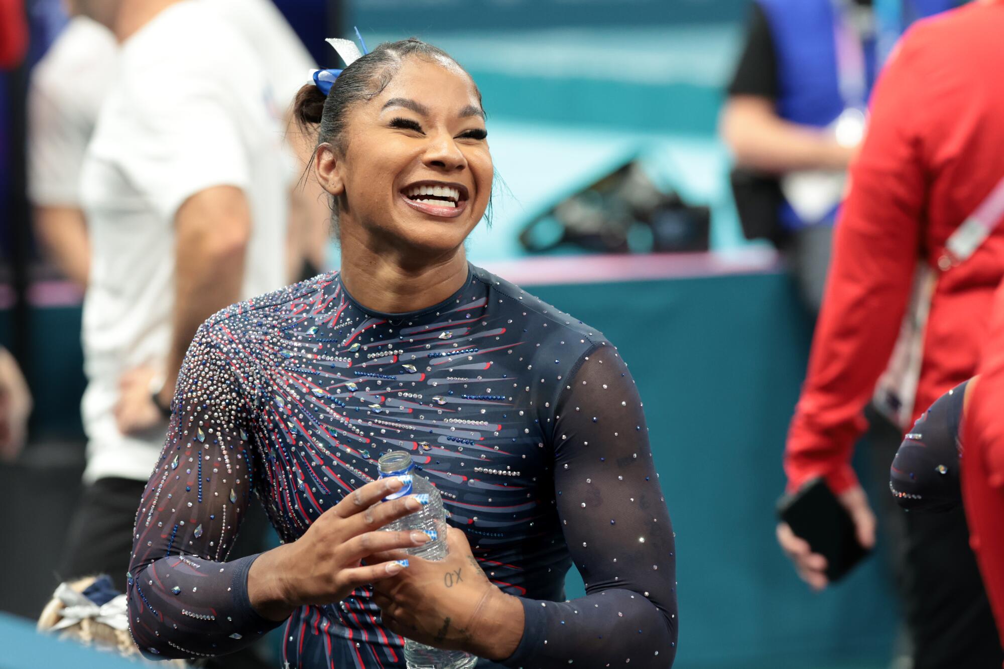 U.S. gymnast Jordan Chiles smiles during podium training.