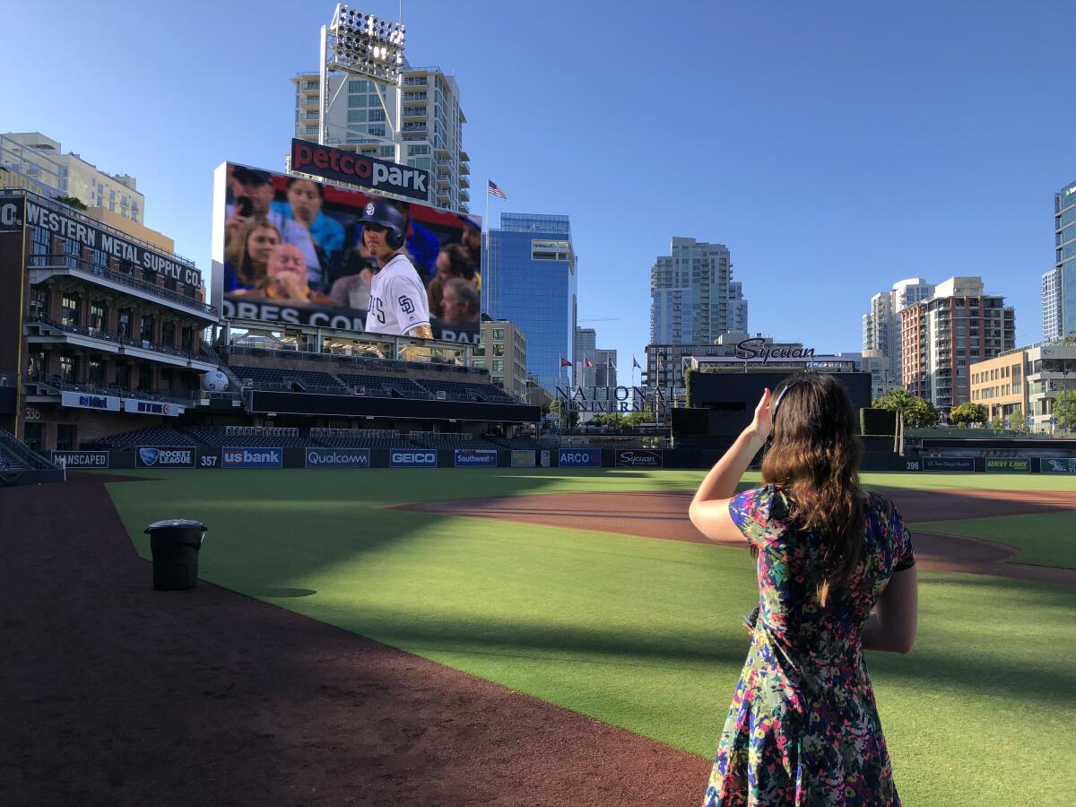 Padres producer of game day presentation Shannon Landers works to coordinate action on the field with artificial crowd noise.