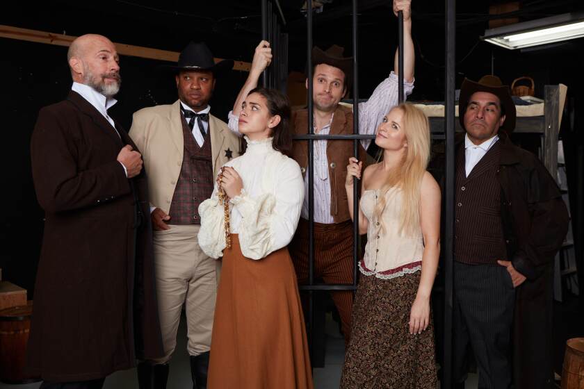 The cast of North Coast Repertory Theatre's "Desperate Measures" pose for a photo