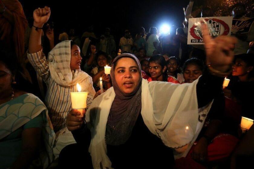 Mandatory Credit: Photo by JAGADEESH NV/EPA-EFE/REX/Shutterstock (9629199b) Indian Muslim women, members of the congress workers and other members of different organizations hold candles during a candle light vigil to protest against the rape and murder of eight-year-old Asifa Bano, in Bangalore, India, 14 April 2018. Indian people staged various protests to bring attention to rape cases and violence against women in India, after eight-year-old girl Asifa Bano was gang-raped and murdered, in Kathua. Protesters demanded justice for Asifa Bano and action against the accused. Candle light vigil for Asifa Bano in Bangalore, India - 14 Apr 2018 ** Usable by LA, CT and MoD ONLY **