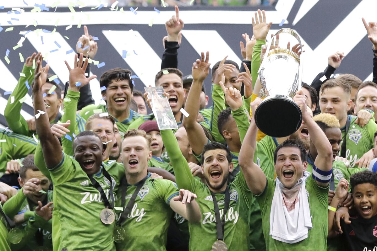 Seattle Sounders celebrate after winning the MLS Cup championship Nov. 10.