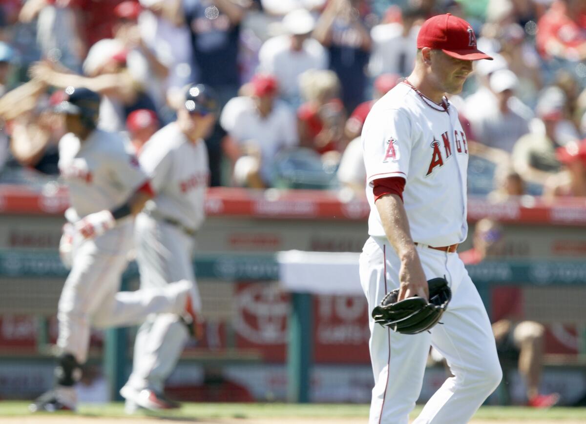 Angels relief pitcher Joe Smith looks away after giving up a three-run home run to Yoenis Cespedes of the Boston Red Sox on Aug. 10. Smith had gone 22 2/3 innings without giving up a run prior to Cespedes' homer.