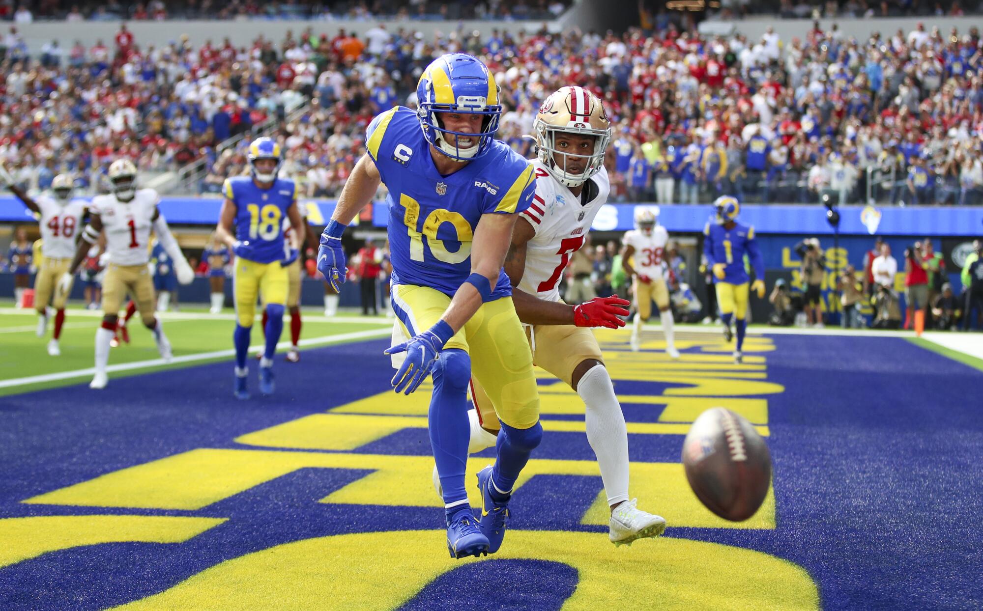 Rams wide receiver Cooper Kupp can't reach a pass in the first half as 49ers defender Charvarius Ward watches.
