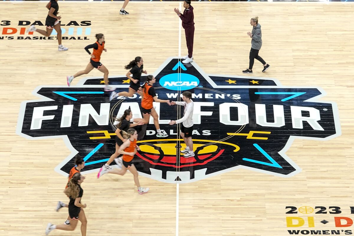 Virginia Tech players run a drill during a practice session for an NCAA Women's Final Four semifinals basketball game Thursday, March 30, 2023, in Dallas. (AP Photo/Darron Cummings)