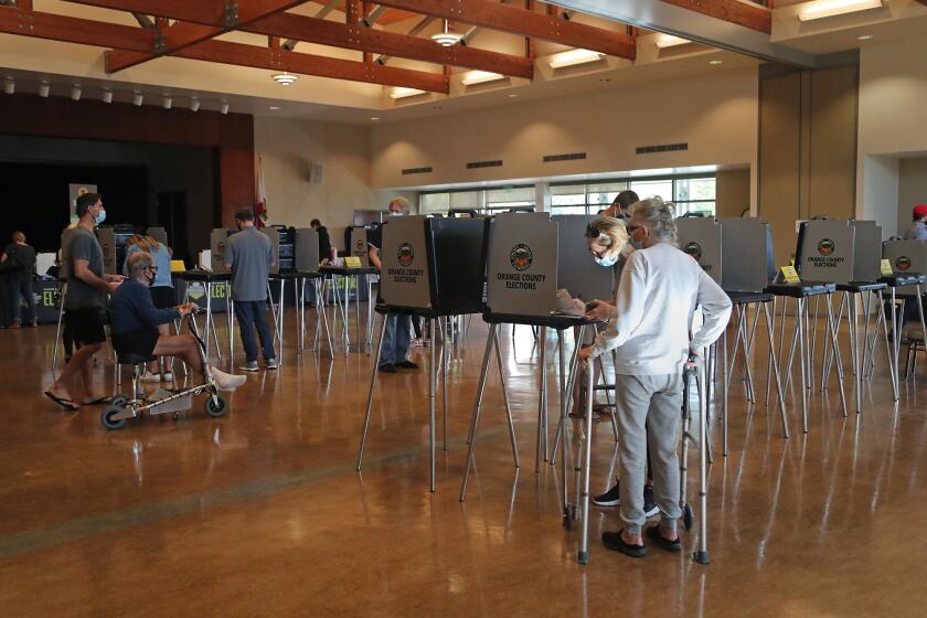Voters make their ballot selections on Election Day 2020 at OASIS Senior Center in Newport Beach on Tuesday.