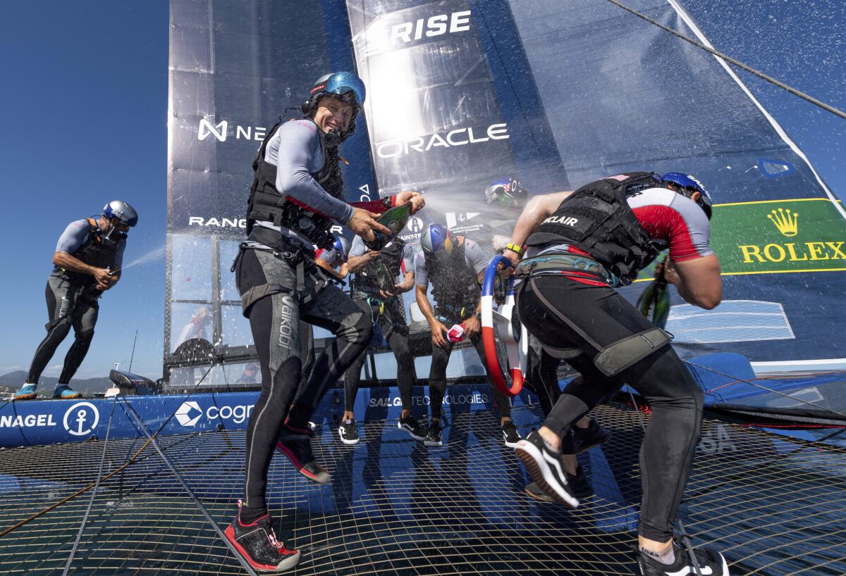USA SailGP Team helmed by Jimmy Spithill and crew celebrate with Champagne Barons de Rothschild on Race Day 2 of the Range Rover France Sail Grand Prix in Saint Tropez, France, Sunday, Sept. 11, 2022. (Ricardo Pinto/SailGP via AP)