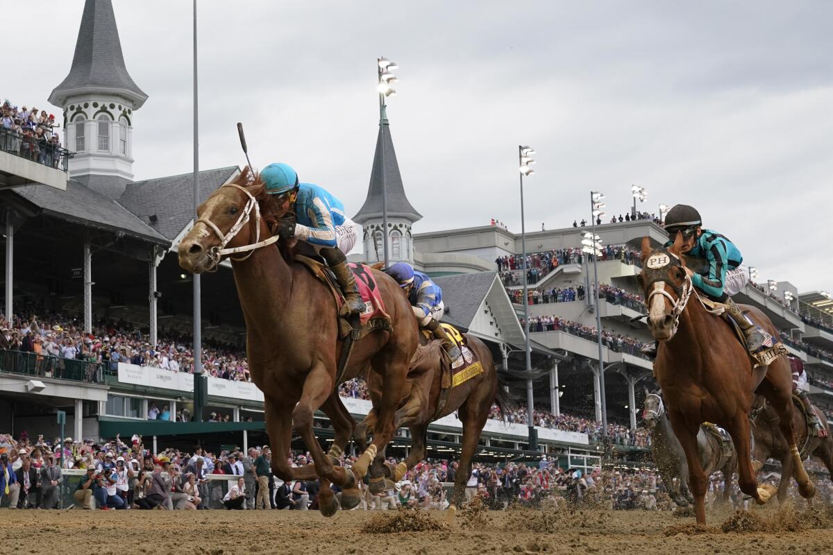 Mage, with Javier Castellano aboard, crosses the finish line to win the 2023 Kentucky Derby.