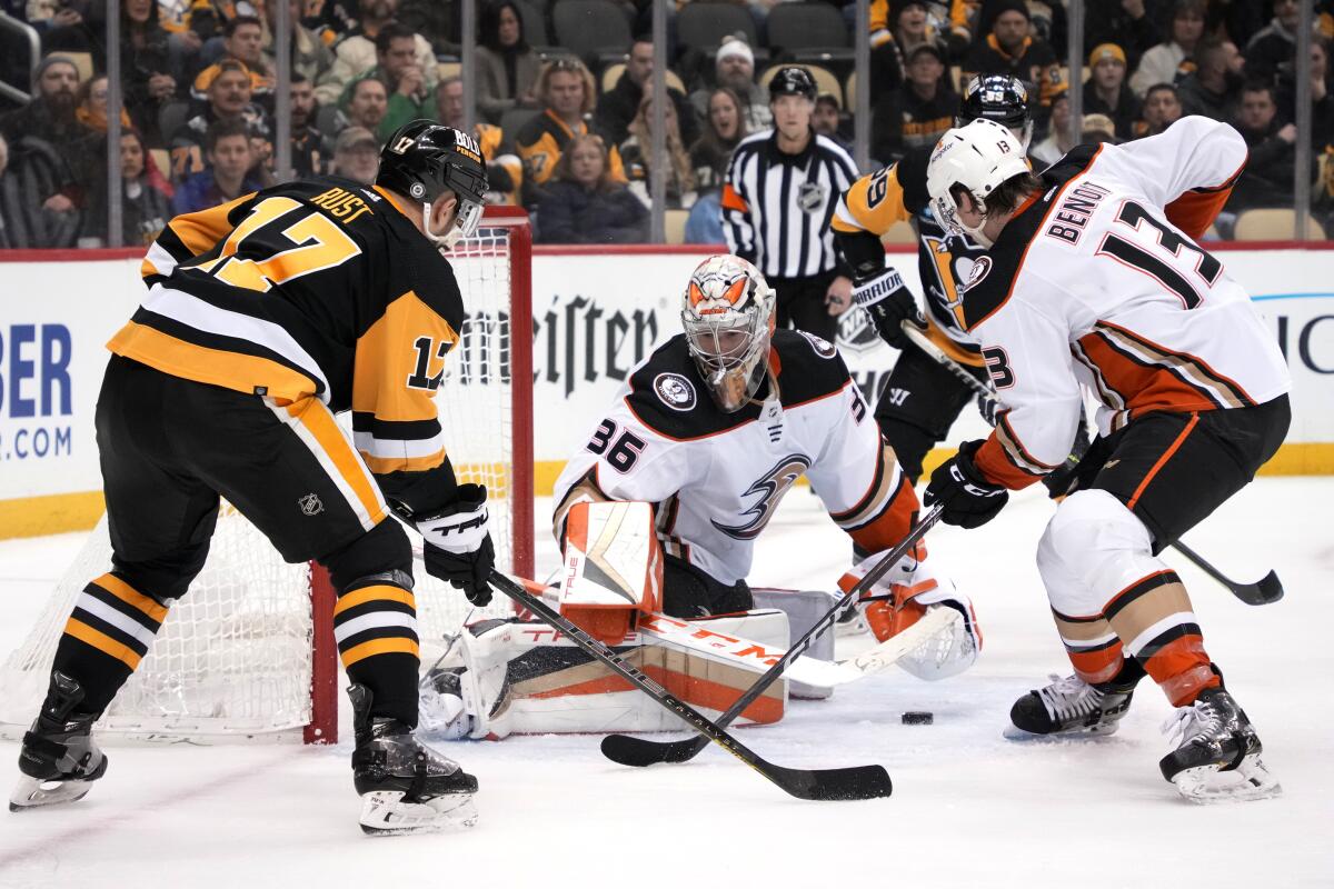 Ducks goaltender John Gibson blocks a shot by Pittsburgh Penguins forward Bryan Rust.