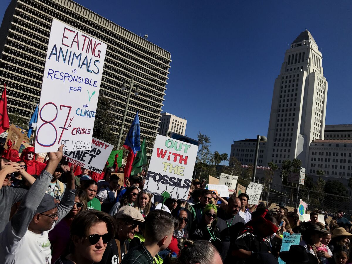 About 3,000 people gather for a youth climate rally, featuring global activist Greta Thunberg, in downtown Los Angeles on Friday, organizers say.