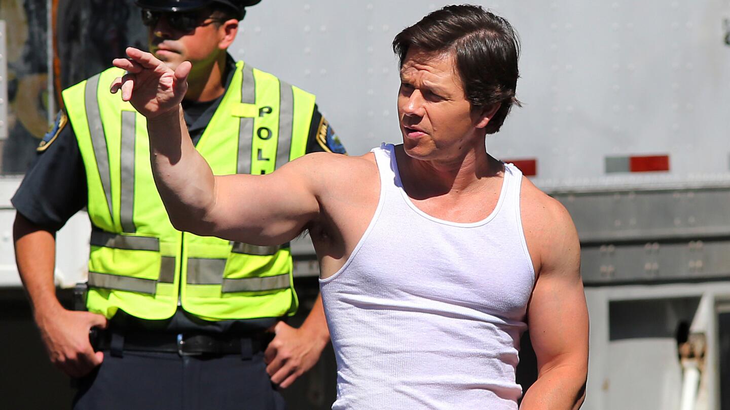 In Milton, Mass., Mark Wahlberg waves to his driver as he leaves the set of "Ted 2."