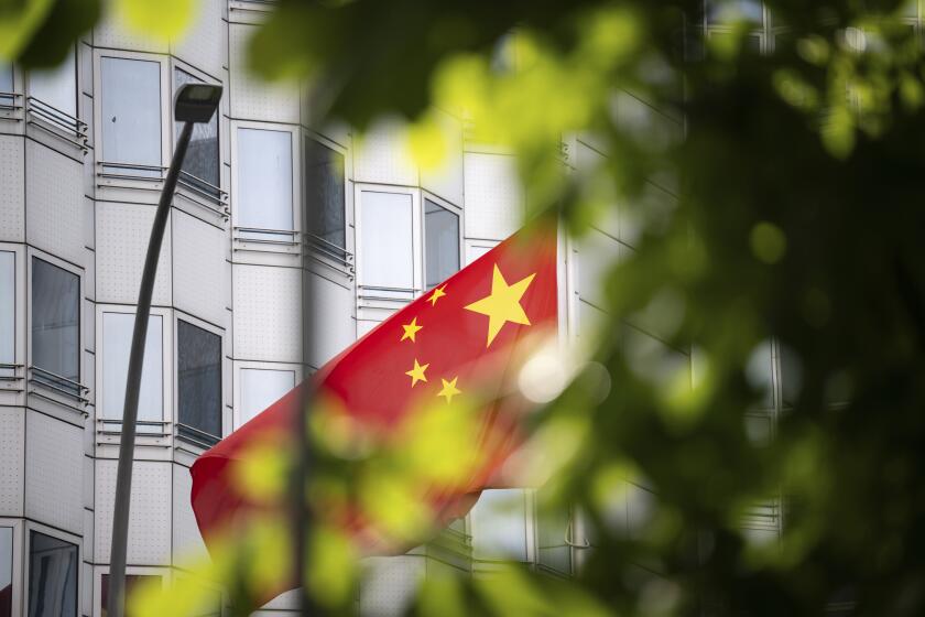 FILE - A country's flag flies in front of the embassy of China in Berlin, Germany, Monday, April 22, 2024. A man who works for a German lawmaker in the European Parliament was arrested on suspicion of spying for China, German prosecutors said Tuesday, April 23. (Hannes P. Albert/dpa via AP, File)