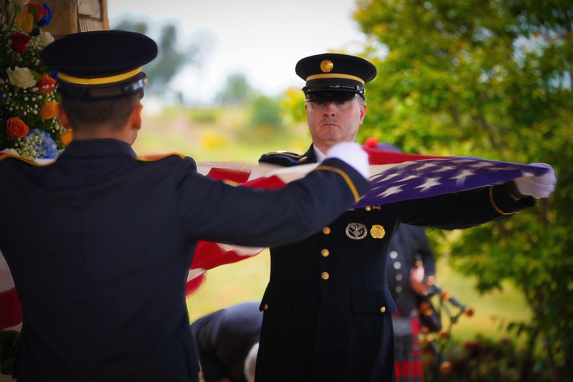 Members of the U.S. Army National Guard Honor Guard fold the a U.S. flag.