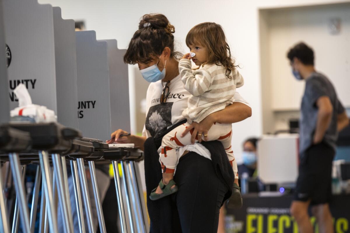 Ashley Montague votes at Marina Park Community Center in Newport Beach on election day.