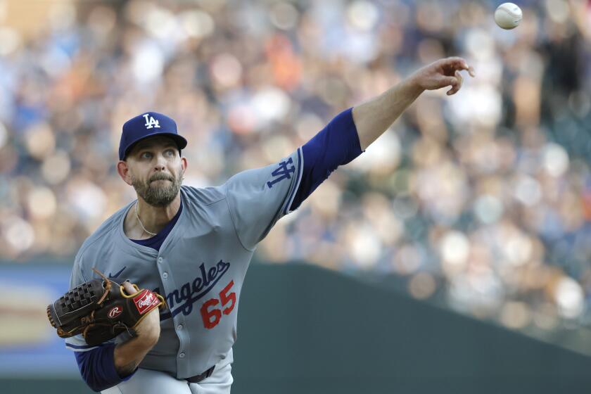 Los Angeles Dodgers' James Paxton pitches against the Detroit Tigers.