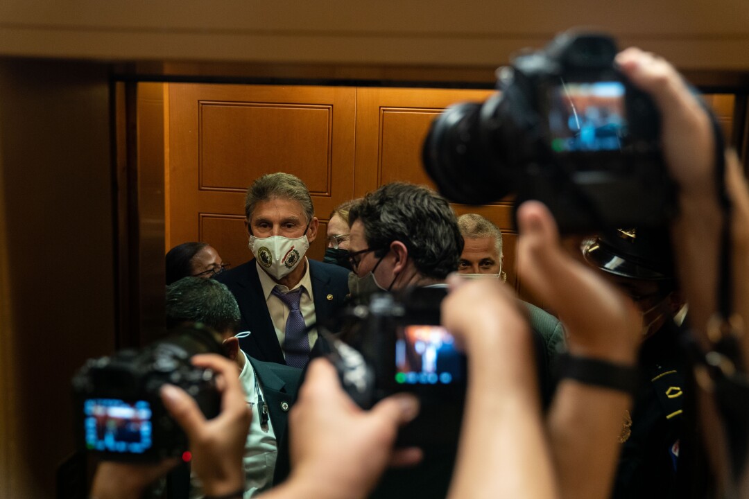 Photographers take images of Joe Manchin