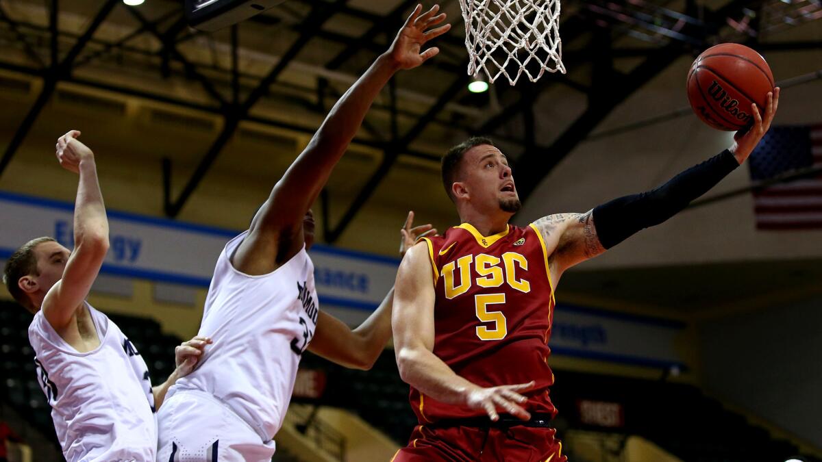 USC guard Katin Reinhardt attempts a reverse layup against Monmouth on Sunday.