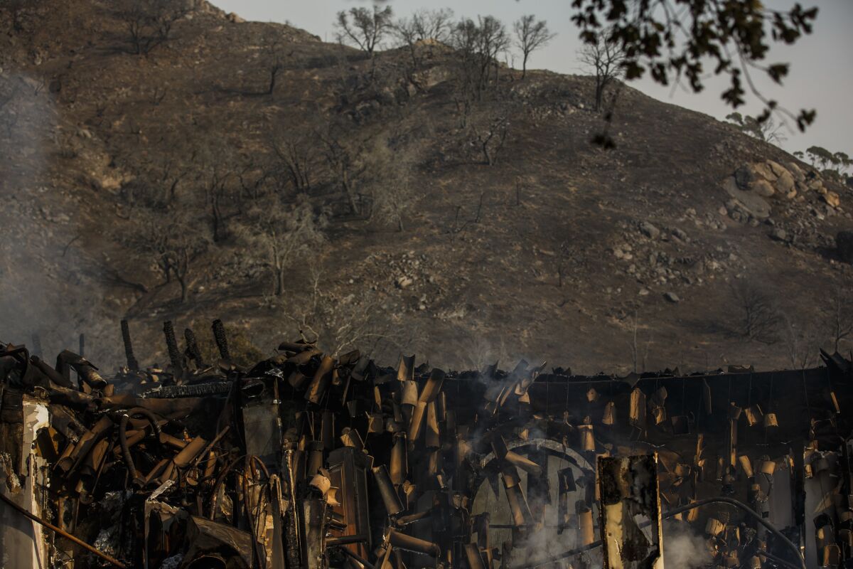 A view of the charred landscape and the falling Spanish tiles of a home that was destroyed by the Thomas fire in Montecito.