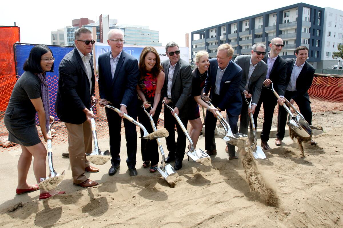Builders, financial backers and architect representatives take part in the ceremonious groundbreaking as Next on Lex construction continues in downtown Glendale on Friday, June 10, 2016.