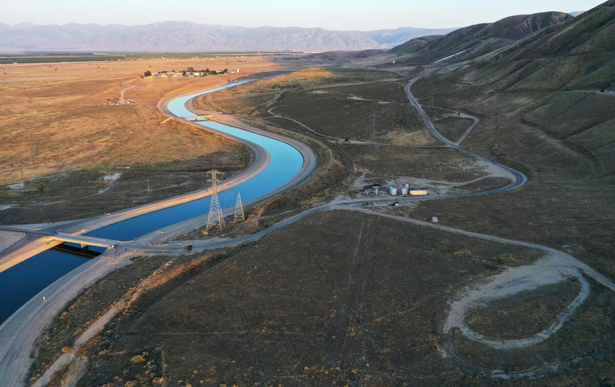 The California Aqueduct winds through open fields near Bakersfield