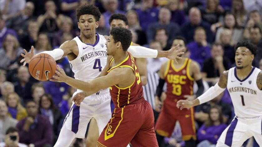 Washington's Matisse Thybulle (4) defends against USC's Derryck Thornton during the first half.