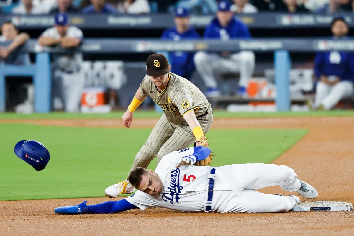 Dodgers baserunner Freddie Freeman beats the tag of San Diego second baseman Jake Cronenworth to steal second base.