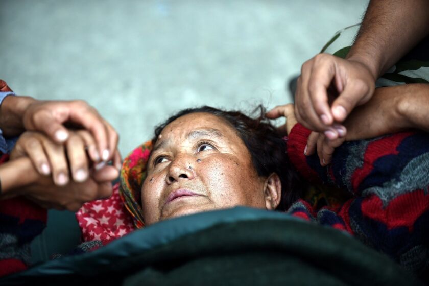 An injured Nepalese woman at a field hospital at a Katmandu airport April 29.