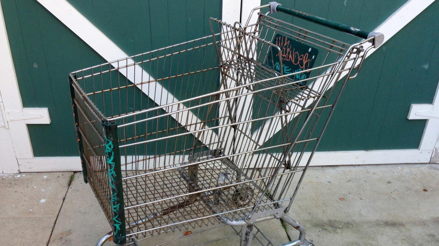 The original grocery cart. Friends of mine found it abandoned, tagged and rusted through.