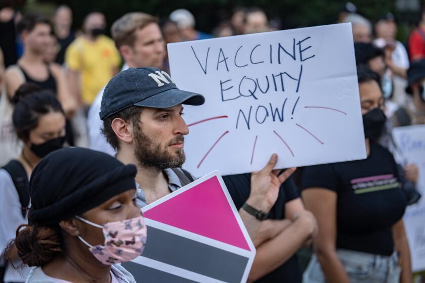 NEW YORK, NY - JULY 21: People protest during a rally calling for more government action to combat the spread of monkeypox at Foley Square on July 21, 2022 in New York City. At least 267 New Yorkers have tested positive for monkeypox, a virus similar to smallpox, but with milder symptoms. (Photo by Jeenah Moon/Getty Images)