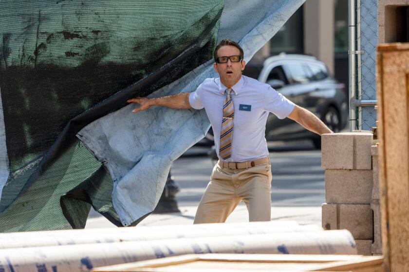 FILE - This image released by 20th Century Studios shows Ryan Reynolds in a scene from "Free Guy." (Alan Markfield/20th Century Studios via AP, File)