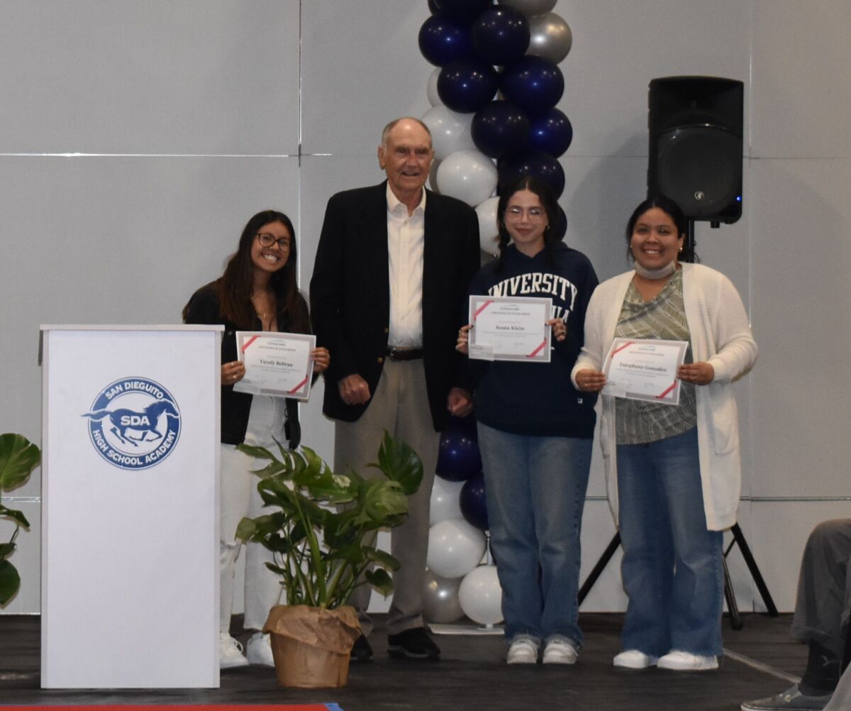 Bill Berrier, former superintendent of SDUHSD, and recipients of the Berrier Scholarship for future educators.