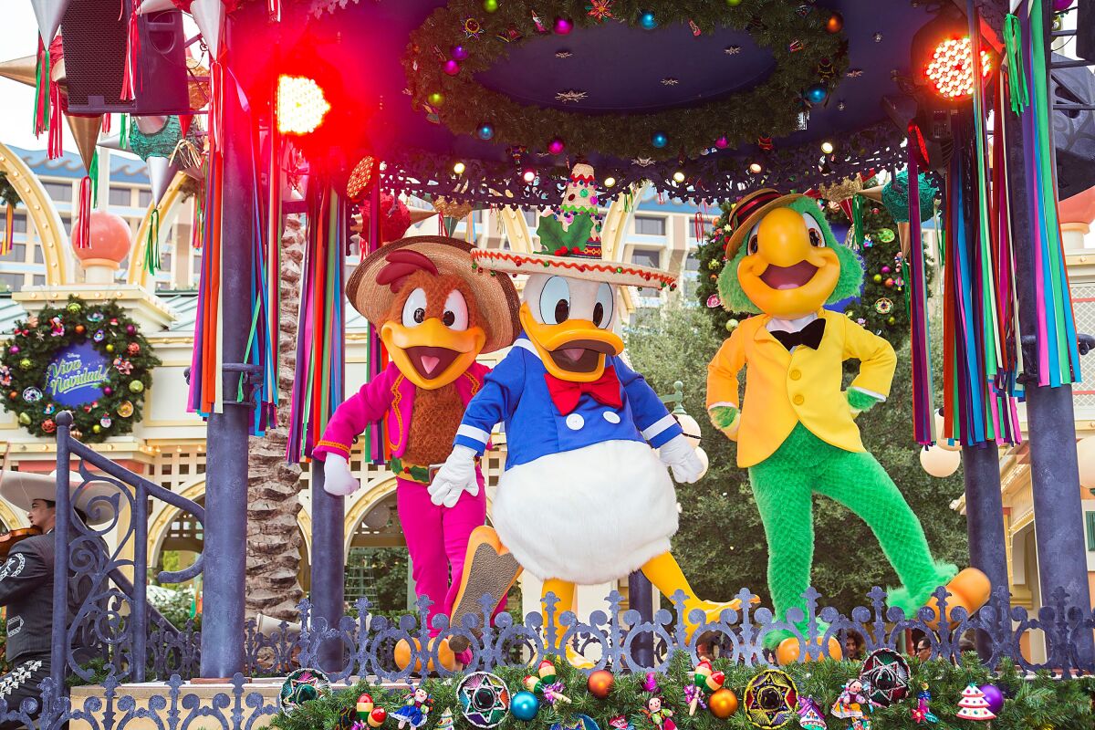 three Disney characters in costume