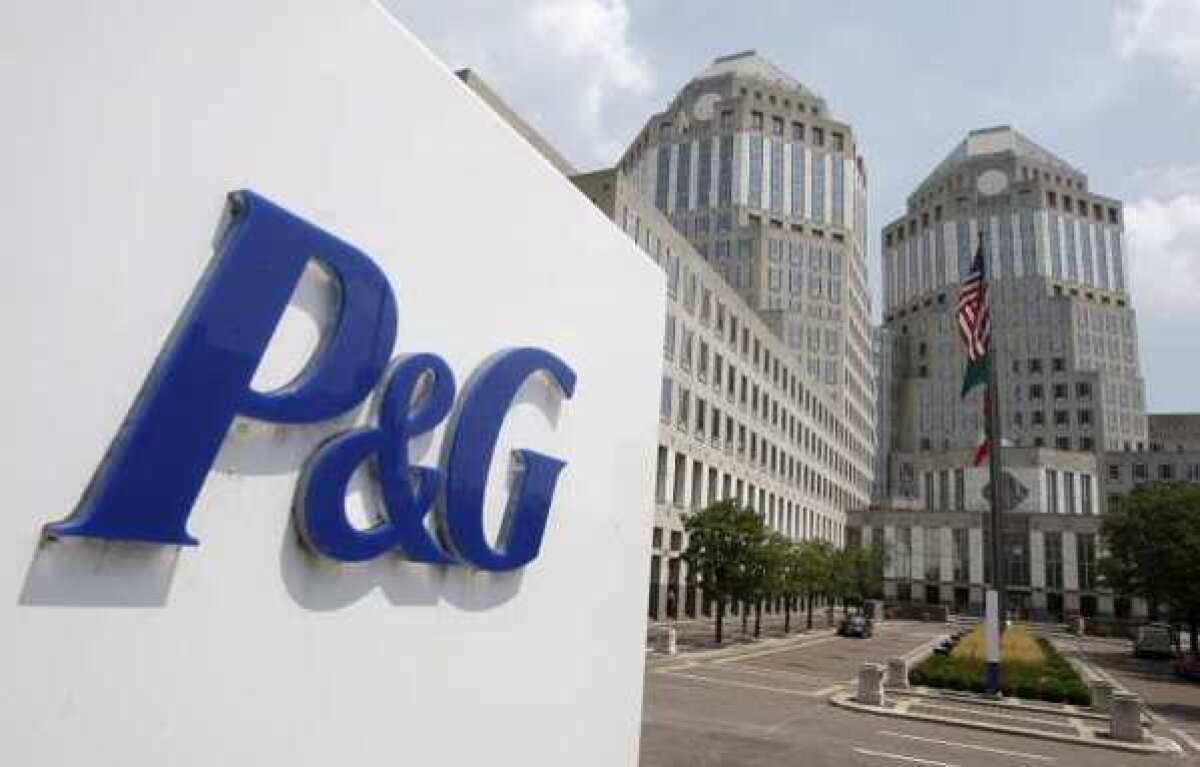 The Procter & Gamble Co. headquarters building in Cincinnati. The company lowered its fourth-quarter earnings and revenue forecasts, hurt by unfavorable foreign exchange rates and continued slow growth in developed markets.