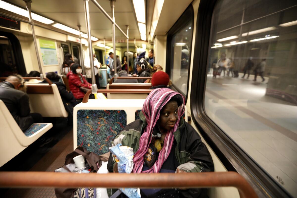 Melissa Crawford, who has been homeless for two years, often rides on the Metro Red Line early in the morning in Los Angeles.