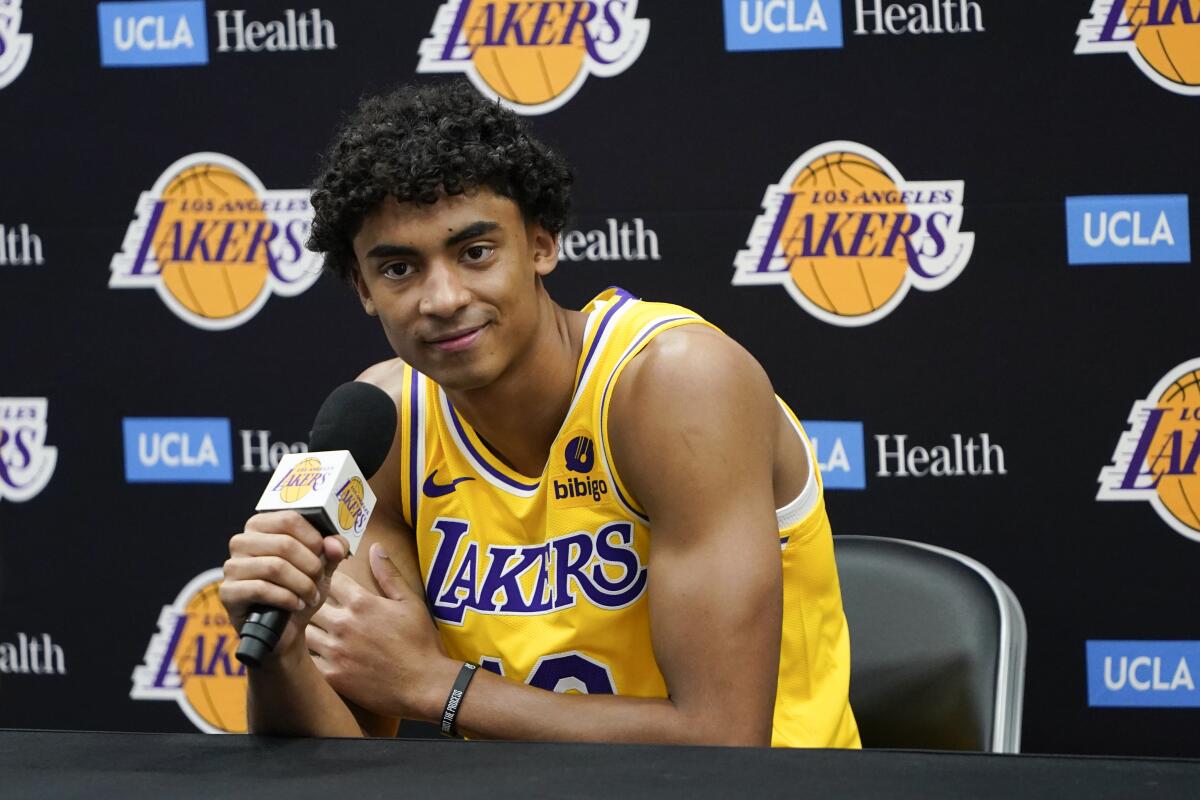 Lakers guard Max Christie listens to a question during a news conference.