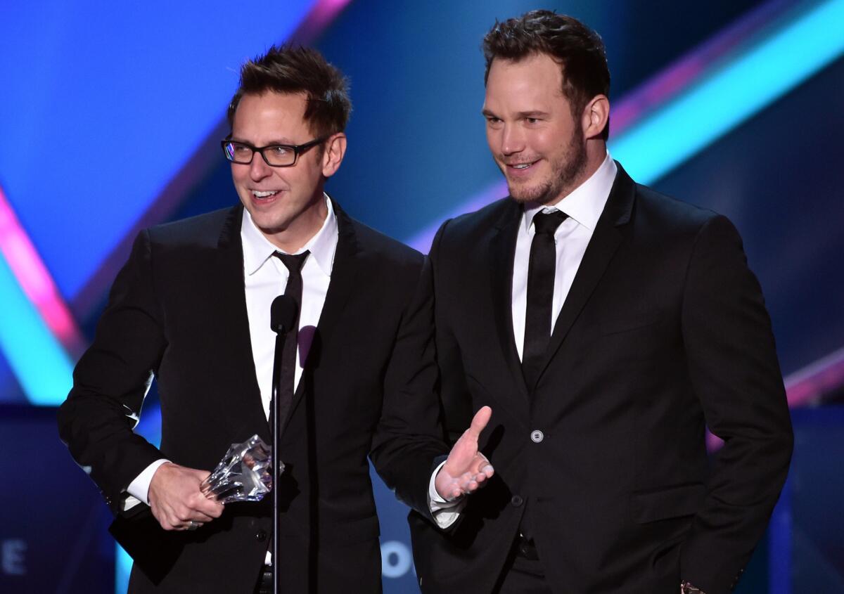Director and writer James Gunn, left, and actor Chris Pratt accept the action movie award for "Guardians of the Galaxy."