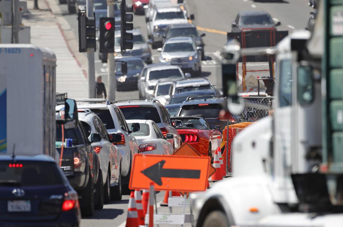 Traffic moves past the Laguna box culvert construction project in downtown Laguna Beach on April 29.