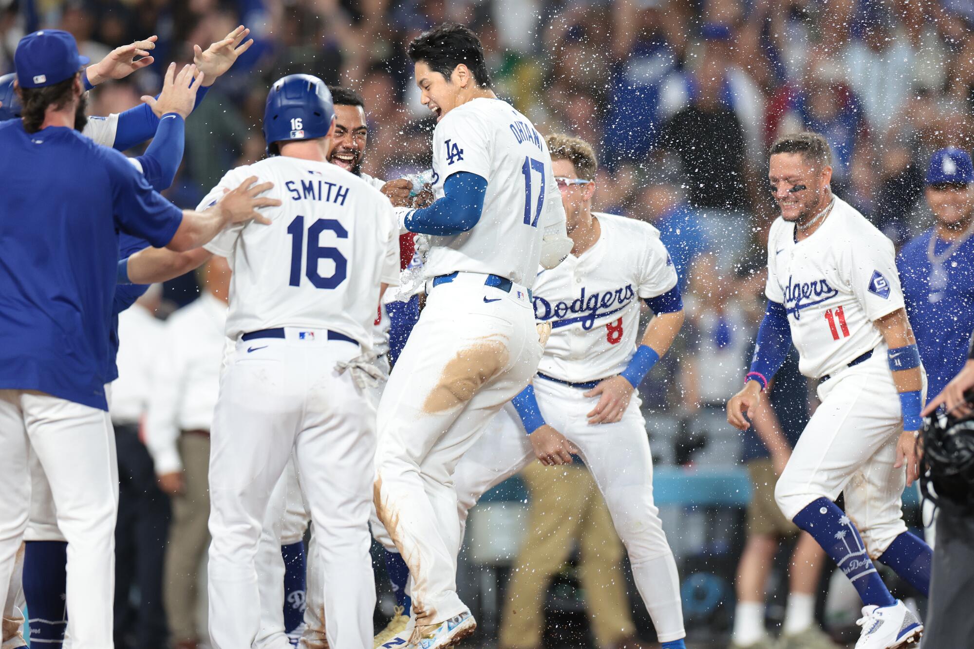 Dodgers star Shohei Ohtani celebrates after hitting a walk-off grand slam in a 7-3 win over the Tampa Bay Rays.